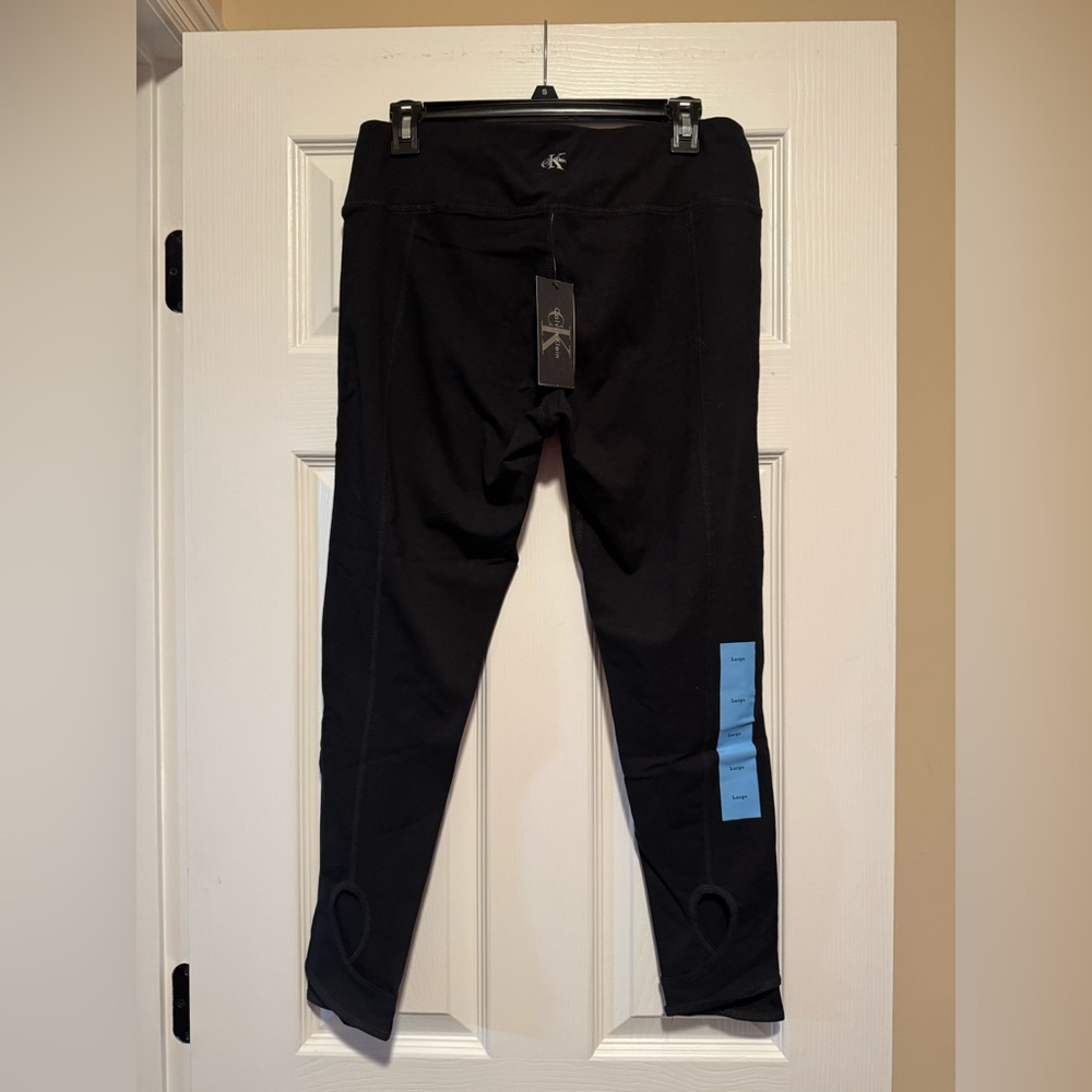 CK performance black keyhole leggings L